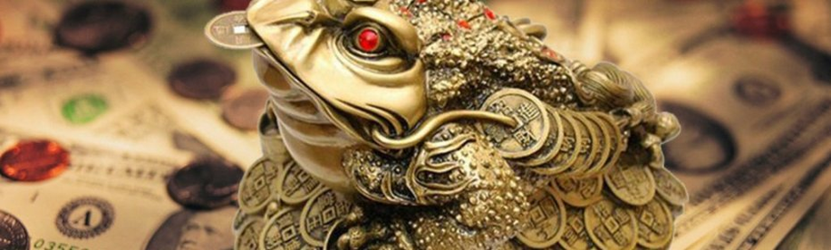 Kodok dengan koin di mulut - jimat untuk menarik uang